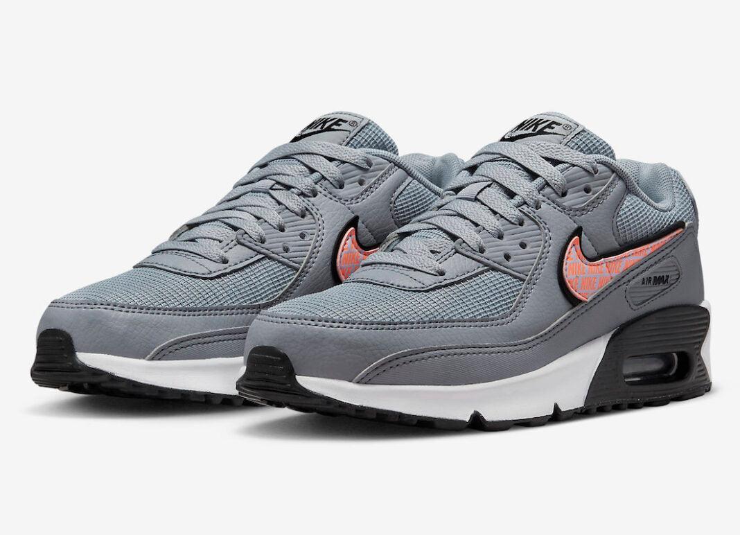 A Greyscale Nike Air Max 90 Detailed With Orange Branding - Rebranded Studios