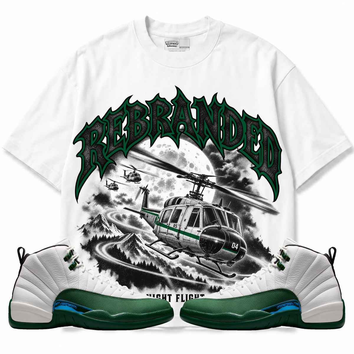 Rebranded Studios Night Flight Air Jordan 12 Bucks Graphic T-Shirt — front with sneakers; bold REBRANDED, gray textured faces, clean collection-color stroke and black outline