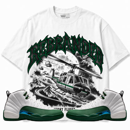 Rebranded Studios Night Flight Air Jordan 12 Bucks Graphic T-Shirt — front with sneakers; bold REBRANDED, gray textured faces, clean collection-color stroke and black outline