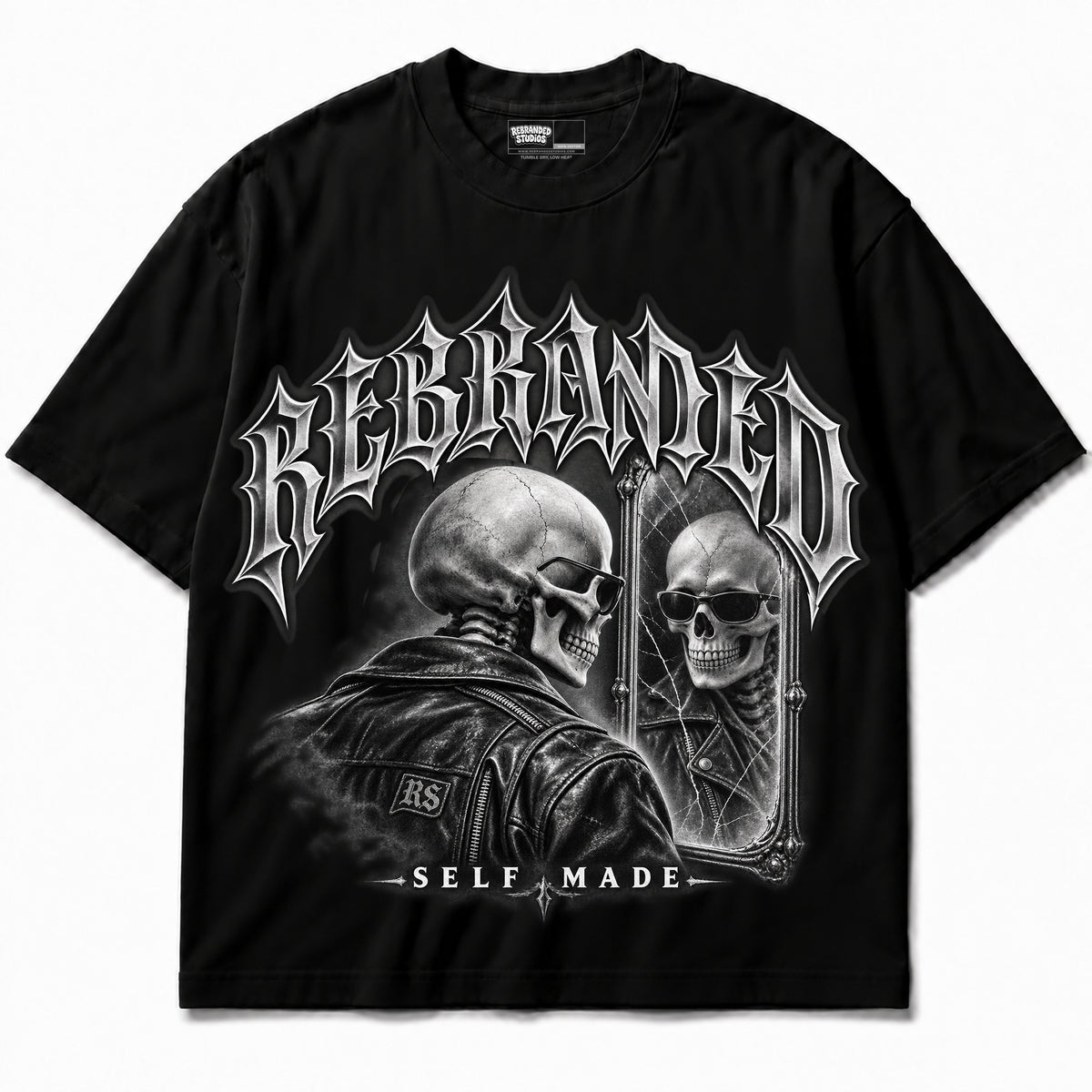 Rebranded Studios Self Made — black shirt garment front; REBRANDED headline, silver artwork; no sneakers