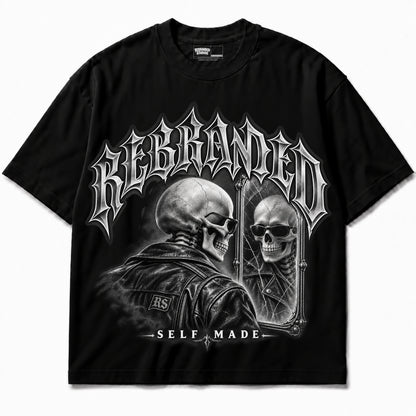 Rebranded Studios Self Made — black shirt garment front; REBRANDED headline, silver artwork; no sneakers