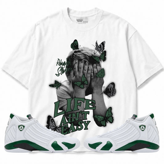 Rebranded Studios Life Ain't Easy Air Jordan 14 Forest Green Graphic T-Shirt — front with matching Forest Green 14 sneakers