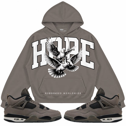 Rebranded Studios apparel — front styled with matching sneakers