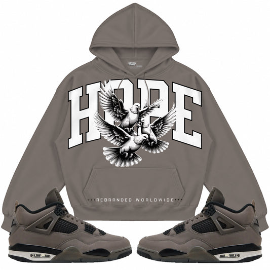 Rebranded Studios apparel — front styled with matching sneakers