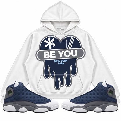 Rebranded Studios apparel — front styled with matching sneakers