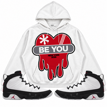 Rebranded Studios apparel — front styled with matching sneakers
