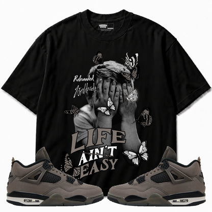 Rebranded Studios apparel — front styled with matching sneakers