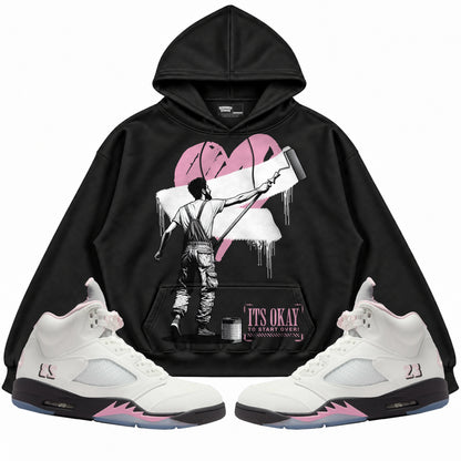 Rebranded Studios apparel — front styled with matching sneakers
