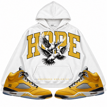 Rebranded Studios apparel — front styled with matching sneakers