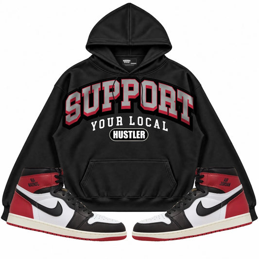Rebranded Studios Support Your Local Hustler Air Jordan 1 High OG Black Toe Reimagined Black hoodie — front with sneakers