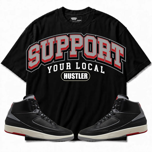 Rebranded Studios Support Your Local Hustler Air Jordan 2 Black Cement Black shirt — front with sneakers