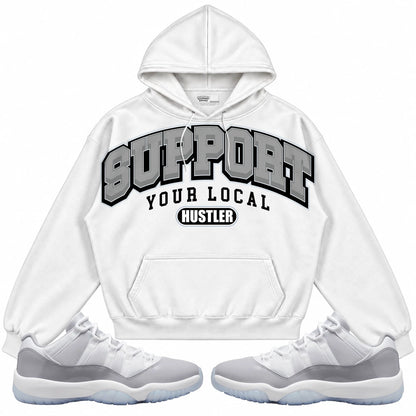 Rebranded Studios Support Your Local Hustler Air Jordan 11 Cement Grey White hoodie — front with sneakers