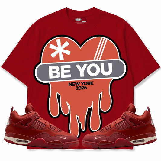 Rebranded Studios Be You Air Jordan 4 Brick By Brick red shirt — front with sneakers
