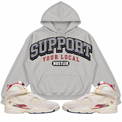 Rebranded Studios Support Your Local Hustler AIR JORDAN 8 X SOLEFLY “MI CASA ES SU CASA" Light Gray hoodie — front with sneakers