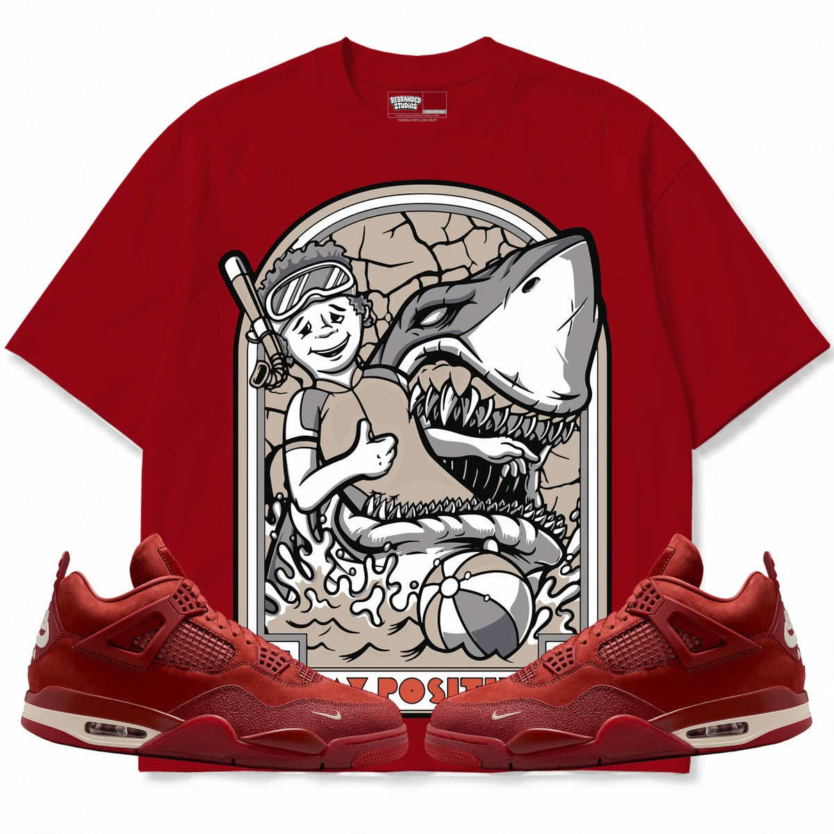 Rebranded Studios Stay Positive Air Jordan 4 Brick By Brick red shirt — front with sneakers