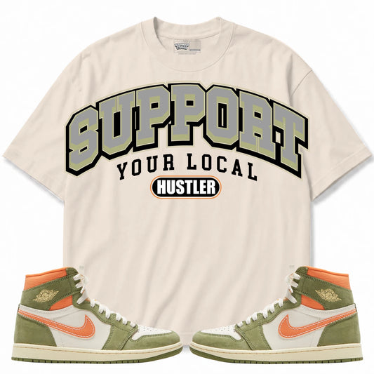 Rebranded Studios Support Your Local Hustler Air Jordan 1 High OG Craft “CELADON” Collection Cream Beige shirt — front with sneakers