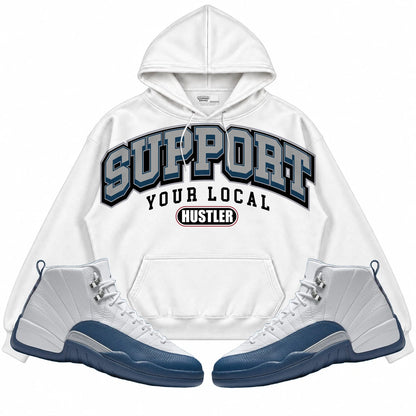 Rebranded Studios Support Your Local Hustler Air Jordan 12 French Blue Collection White hoodie — front with sneakers
