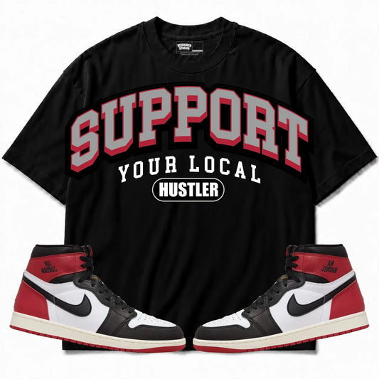 Rebranded Studios Support Your Local Hustler Air Jordan 1 High OG Black Toe Reimagined Black shirt — front with sneakers