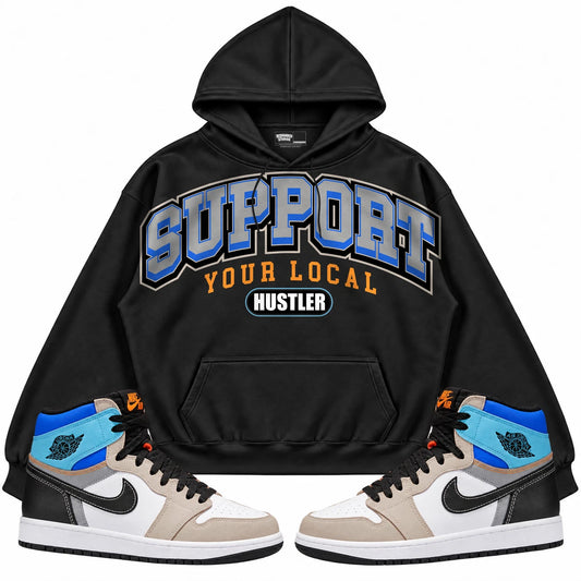 Rebranded Studios Support Your Local Hustler Air Jordan Retro 1 Prototype Black hoodie — front with sneakers